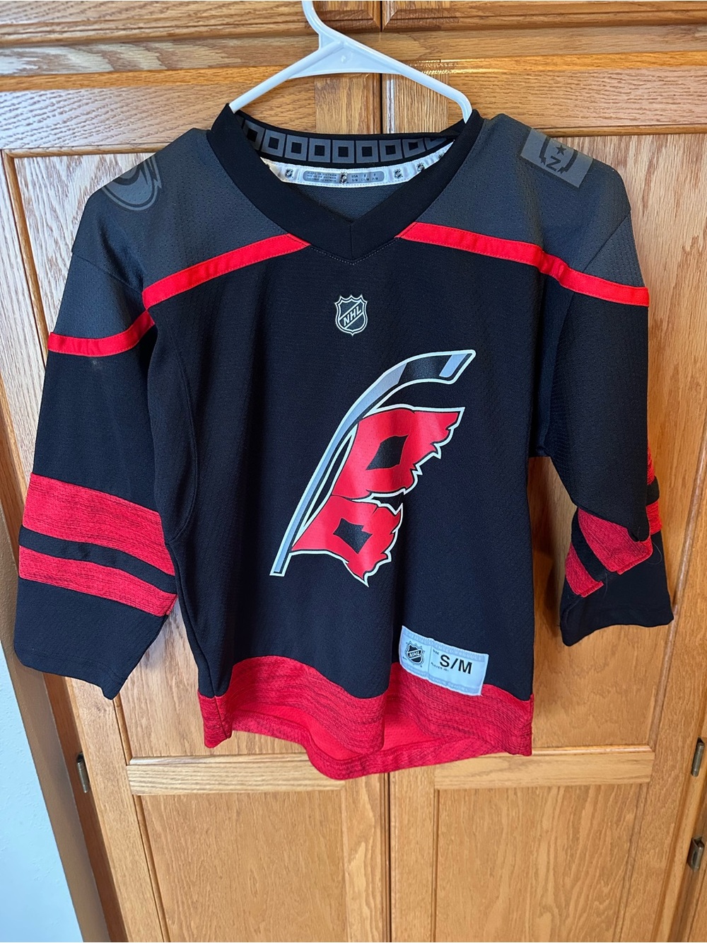 NHL Carolina Hurricanes Black and Red Youth Hockey Jersey size S/M
